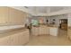 Well-designed kitchen with ample storage, eat-in breakfast bar, and easy access to the dining area at 15020 Acorn Cir, Port Charlotte, FL 33981