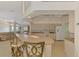 Spacious open-concept kitchen with a breakfast bar, modern appliances, and views of the living room at 15020 Acorn Cir, Port Charlotte, FL 33981