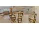 Lovely eat-in kitchen with island bar and comfortable breakfast seating, plus views to the living room at 15020 Acorn Cir, Port Charlotte, FL 33981