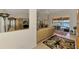 Open concept living space flows into a dining area with views of the lanai and canal at 15020 Acorn Cir, Port Charlotte, FL 33981