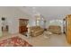 Spacious living room featuring cathedral ceilings, comfortable seating, and tile floors at 15020 Acorn Cir, Port Charlotte, FL 33981