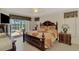 This main bedroom includes lanai access, providing beautiful waterfront views at 15020 Acorn Cir, Port Charlotte, FL 33981