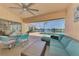 Charming lanai with comfortable seating, glass table, and picturesque views of the pool and waterway at 15020 Acorn Cir, Port Charlotte, FL 33981
