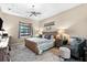 Cozy bedroom with a view outside, bedside table, and comfortable furniture at 15044 San Domingo Blvd, Port Charlotte, FL 33981
