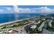 Aerial view of the beach showing beach access, parking, and nearby residential area with beautiful beachside views at 1551 Beach Rd # 212, Englewood, FL 34223