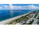 Breathtaking aerial view of the beach, the turquoise ocean, and a picturesque coastal road in beautiful location at 1551 Beach Rd # 212, Englewood, FL 34223