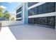 Exterior balcony with tropical landscaping at 1551 Beach Rd # 212, Englewood, FL 34223