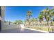 Outdoor balcony with tropical landscaping and water views at 1551 Beach Rd # 212, Englewood, FL 34223