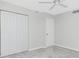Bedroom featuring a ceiling fan and double door closet at 1551 Beach Rd # 212, Englewood, FL 34223