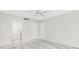 Bright bedroom with neutral colors, ceiling fan, and multiple closets at 1551 Beach Rd # 212, Englewood, FL 34223