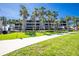 Apartment complex with lush tropical landscaping at 1551 Beach Rd # 212, Englewood, FL 34223