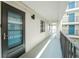 Hallway with view of exterior and apartment door at 1551 Beach Rd # 212, Englewood, FL 34223