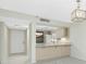 Modern kitchen boasts light wood cabinets, an open design and stainless steel appliances at 1551 Beach Rd # 212, Englewood, FL 34223