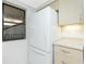 Bright kitchen featuring modern appliances including a Whirlpool refrigerator and light wood cabinetry at 1551 Beach Rd # 212, Englewood, FL 34223