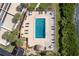 Aerial view of rectangular pool surrounded by lush, tropical landscaping at 1551 Beach Rd # 212, Englewood, FL 34223