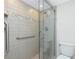 Modern shower with clear glass enclosure and decorative tile accents at 1551 Beach Rd # 212, Englewood, FL 34223