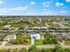 Expansive aerial perspective of a residential area with waterfront properties, highlighting the canal system and community layout at 15850 Viscount Cir, Port Charlotte, FL 33981