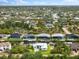 Aerial view of a waterfront home in a residential neighborhood at 15850 Viscount Cir, Port Charlotte, FL 33981