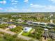 Beautiful aerial shot of canal-front homes, each with private docks, surrounded by vibrant landscaping and serene waterways at 15850 Viscount Cir, Port Charlotte, FL 33981