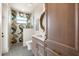 Modern bathroom with patterned tile, walk-in shower and wooden cabinets at 15850 Viscount Cir, Port Charlotte, FL 33981