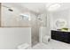 Modern bathroom featuring a glass-enclosed shower, sleek vanity, and stylish lighting at 15850 Viscount Cir, Port Charlotte, FL 33981