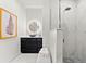 Modern bathroom featuring vanity, shower, framed art, stylish lighting and a unique shower system at 15850 Viscount Cir, Port Charlotte, FL 33981