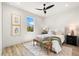 Well lit bedroom with decor, natural light and hardwood floors at 15850 Viscount Cir, Port Charlotte, FL 33981