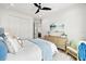 Stylishly decorated bedroom with a ceiling fan and neutral decor at 15850 Viscount Cir, Port Charlotte, FL 33981