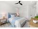 Bright bedroom featuring a queen size bed and coastal-themed decor at 15850 Viscount Cir, Port Charlotte, FL 33981