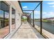 The outdoor living space features an enclosed pool and patio, perfect for entertaining with stunning waterfront views at 15850 Viscount Cir, Port Charlotte, FL 33981