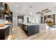 Open concept kitchen featuring a large island, stainless steel appliances, and seamless access to the living area at 15850 Viscount Cir, Port Charlotte, FL 33981
