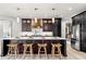 Spacious kitchen featuring a central island, pendant lighting, modern cabinetry, and stainless steel appliances at 15850 Viscount Cir, Port Charlotte, FL 33981