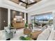 Elegant living room boasts a tray ceiling, stylish decor, and seamless transition to the outdoor pool area at 15850 Viscount Cir, Port Charlotte, FL 33981
