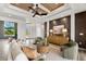Inviting living room area with comfortable seating, elegant decor, and views of the outdoor lanai at 15850 Viscount Cir, Port Charlotte, FL 33981
