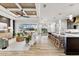 Bright and open living area with ceiling fan, overlooking the screened in patio and kitchen at 15850 Viscount Cir, Port Charlotte, FL 33981