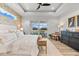 Bright and airy main bedroom with ceiling fan and outdoor access at 15850 Viscount Cir, Port Charlotte, FL 33981