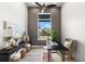 Cozy home office with natural light, a ceiling fan, and views of the outdoors at 15850 Viscount Cir, Port Charlotte, FL 33981
