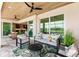A comfortable outdoor patio offers a tranquil setting with plush seating, stylish decor, and access to the home's interior at 15850 Viscount Cir, Port Charlotte, FL 33981