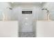 Luxury shower with dual shower heads, glass enclosures, and decorative tile, complemented by seating at 15850 Viscount Cir, Port Charlotte, FL 33981