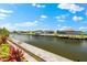 A serene canal-front view highlighting lush landscaping, dockage, and waterfront homes at 15850 Viscount Cir, Port Charlotte, FL 33981
