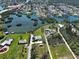 Aerial view of waterfront homes, canals, and lush landscaping at 1605 Manor Rd, Englewood, FL 34223