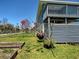 A charming backyard with a well-maintained lawn and an elevated deck, perfect for outdoor relaxation at 1605 Manor Rd, Englewood, FL 34223