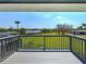 Expansive backyard view from the deck, showcasing lush greenery and waterfront access at 1605 Manor Rd, Englewood, FL 34223