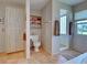 Bathroom featuring a walk-in shower, neutral-toned walls, and built-in storage at 1605 Manor Rd, Englewood, FL 34223