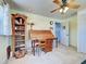 Bright home office with a rolltop desk and ample storage at 1605 Manor Rd, Englewood, FL 34223