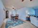 Dining room featuring hardwood chairs and a beautiful area rug at 1605 Manor Rd, Englewood, FL 34223