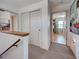 Hallway area that connects to a utility room, visible from the upper level at 1605 Manor Rd, Englewood, FL 34223
