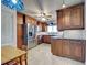 Beautiful kitchen featuring dark wood cabinets and stainless steel appliances at 1605 Manor Rd, Englewood, FL 34223