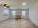 Living room featuring gray floors and two windows providing natural light at 1605 Manor Rd, Englewood, FL 34223
