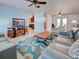 Spacious living area with stylish decor and access to other rooms at 1605 Manor Rd, Englewood, FL 34223